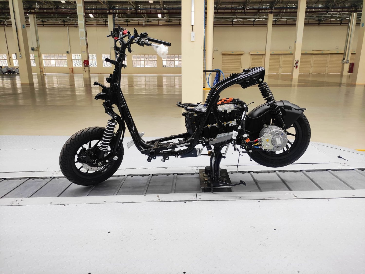 Chetak EV chassis with battery pack and hub motor assembled on the conveyor
