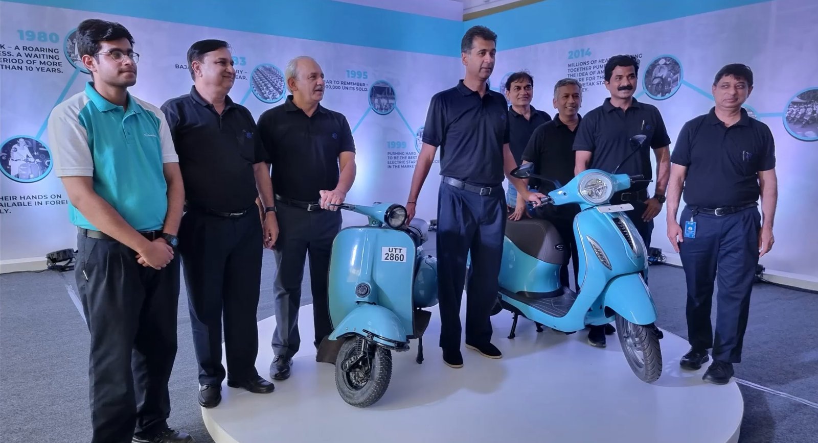 The team with the original Chetak and the new electric Chetak, past and present side by side